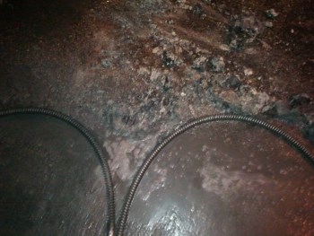 Rodding main sewer which was filled with baby wipes and grease